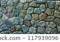 Stone wall texture background. The wall of the building is lined with stones. The stones in the wall are of medium size 117939096