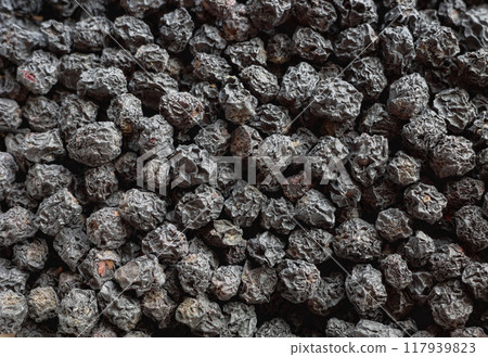 Close up photo of dried Aronia melanocarpa (black chokeberry), selective focus. Close up photo of dried Aronia melanocarpa (black chokeberry), selective focus. 117939823