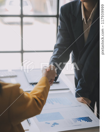 Business handshake for teamwork of business merger and acquisition,successful negotiate,hand shake,two businessman shake hand with partner to celebration partnership and business deal concept 117939999