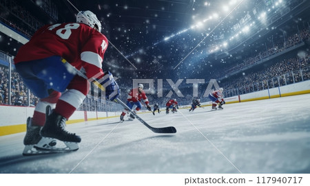 Fast-paced ice hockey game in a packed arena 117940717