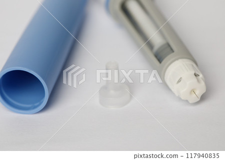 Injection pen with insulin for diabetics on white background close-up 117940835