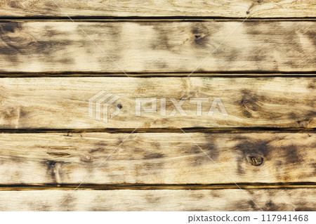 The wooden surface of the horizontal boards with black annealed places The wooden surface of the horizontal boards with black annealed places 117941468