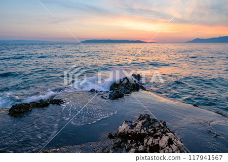 Colorful sunset on Makarska Riviera, popular touristic coastline of the Adriatic Sea in Split-Dalmatia County of Croatia 117941567