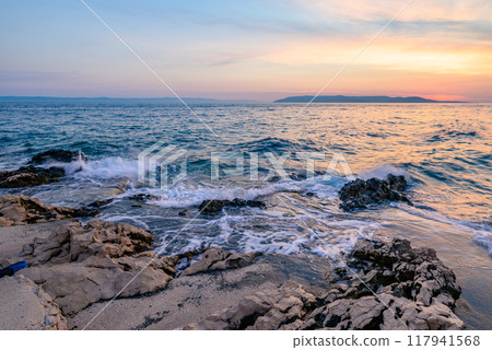 Colorful sunset on Makarska Riviera, popular touristic coastline of the Adriatic Sea in Split-Dalmatia County of Croatia 117941568