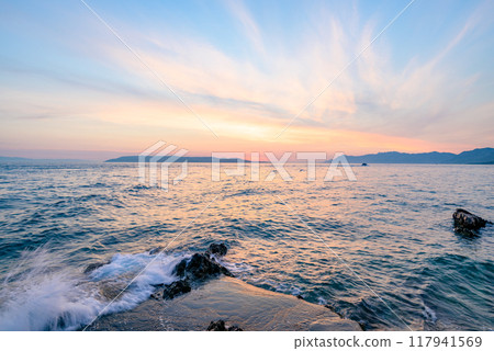 Colorful sunset on Makarska Riviera, popular touristic coastline of the Adriatic Sea in Split-Dalmatia County of Croatia 117941569