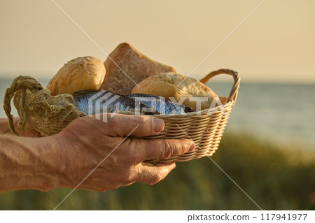Christianity, religion, Bible concept. Five loaves of bread and two fish 117941977