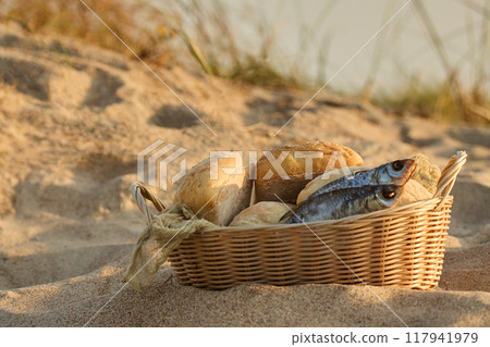 Christianity, religion, Bible concept. Five loaves of bread and two fish Christianity, religion, Bible concept. Five loaves of bread and two fish 117941979
