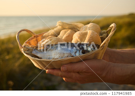 Christianity, religion, Bible concept. Five loaves of bread and two fish Christianity, religion, Bible concept. Five loaves of bread and two fish 117941985