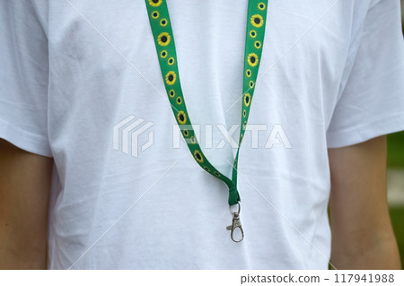 Sunflower lanyard, symbol of people with invisible or hidden disabilities. Sunflower lanyard, symbol of people with invisible or hidden disabilities. 117941988