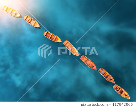 Aerial view of beautiful wooden boats in Braies lake, Italy Aerial view of beautiful wooden boats in Braies lake, Italy 117942066