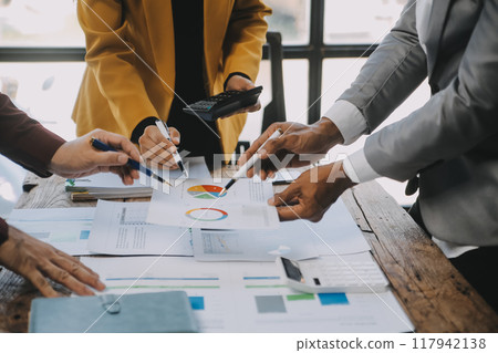 Group of Young Asian business team creative businesspeople coworker in office Happy to be successful partnership teamwork celebrating achievement and success concept. 117942138