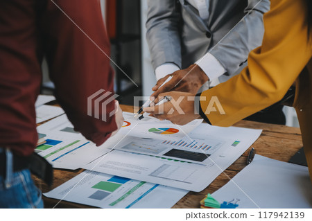 Group of Young Asian business team creative businesspeople coworker in office Happy to be successful partnership teamwork celebrating achievement and success concept. 117942139