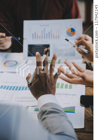 Group of Young Asian business team creative businesspeople coworker in office Happy to be successful partnership teamwork celebrating achievement and success concept. 117942145