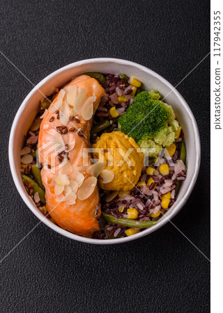 A piece of boiled salmon with rice, broccoli, salt and spices A piece of boiled salmon with rice, broccoli, salt and spices 117942355