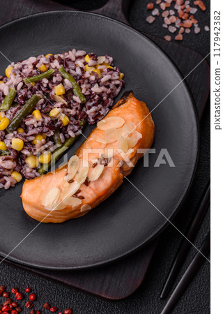 A piece of boiled salmon with rice, broccoli, salt and spices A piece of boiled salmon with rice, broccoli, salt and spices 117942382