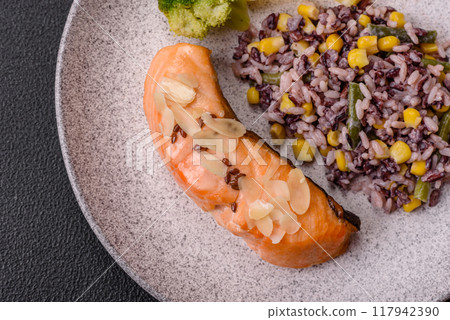 A piece of boiled salmon with rice, broccoli, salt and spices A piece of boiled salmon with rice, broccoli, salt and spices 117942390