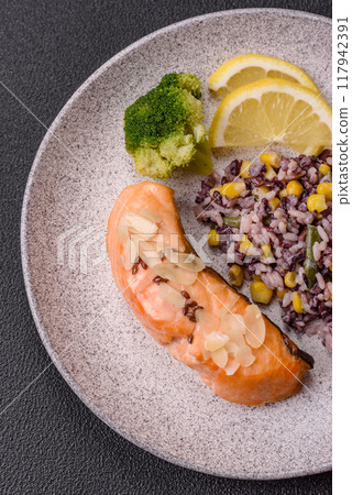 A piece of boiled salmon with rice, broccoli, salt and spices A piece of boiled salmon with rice, broccoli, salt and spices 117942391
