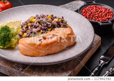A piece of boiled salmon with rice, broccoli, salt and spices A piece of boiled salmon with rice, broccoli, salt and spices 117942392