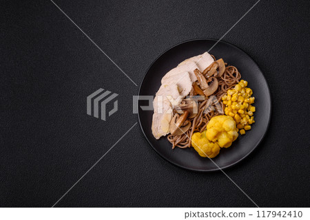 Asian dish with sliced chicken fillet, buckwheat noodles, soy sauce Asian dish with sliced chicken fillet, buckwheat noodles, soy sauce 117942410