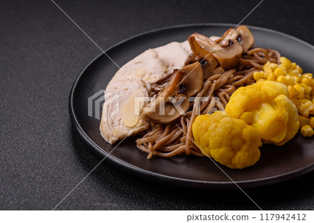 Asian dish with sliced chicken fillet, buckwheat noodles, soy sauce 117942412