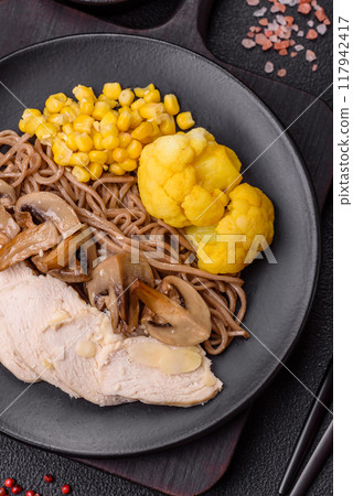 Asian dish with sliced chicken fillet, buckwheat noodles, soy sauce 117942417