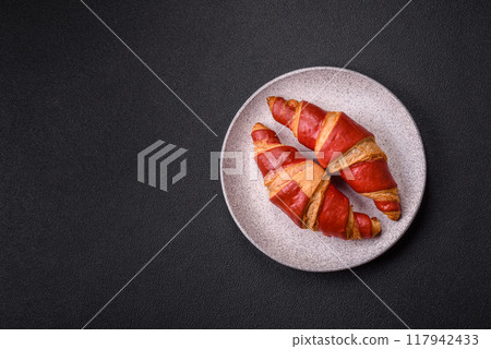 Delicious fresh crispy croissants with chocolate filling Delicious fresh crispy croissants with chocolate filling 117942433