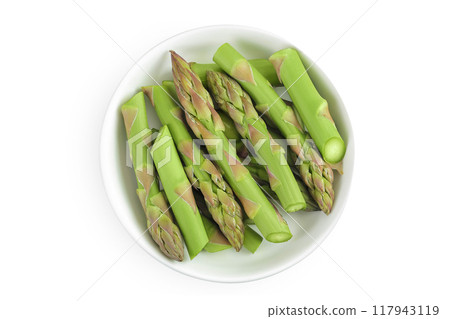 fresh asparagus in ceramic bowl isolated on white background. Top view. Flat lay. fresh asparagus in ceramic bowl isolated on white background. Top view. Flat lay. 117943119