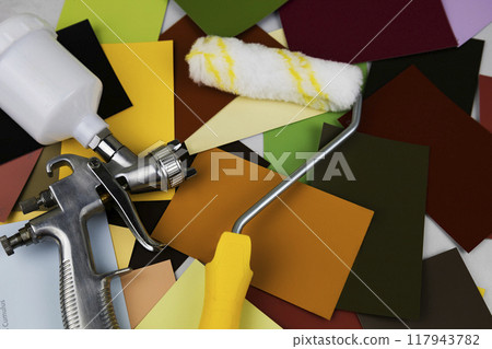 Paint spray gun at work at the workplace in the workshop. Paint Brush 117943782