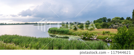 Green landscape and inner water of the Kage bay, Denmark Green landscape and inner water of the Kage bay, Denmark 117944621
