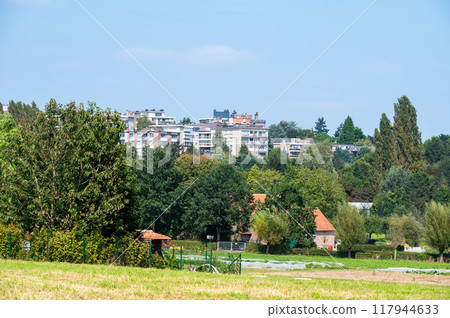 Residential houses and green hills at the Flemish countryside in Dilbeek, Brabant, Belgium Residential houses and green hills at the Flemish countryside in Dilbeek, Brabant, Belgium 117944633