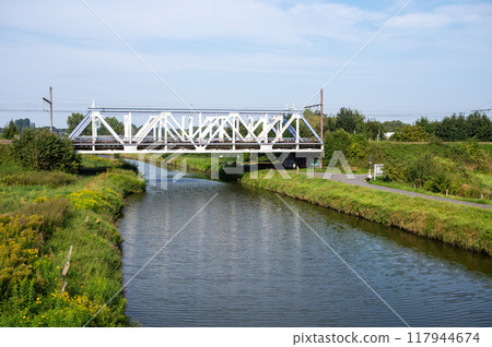 Denderleeuw, East Flemish Region, belgium, Aug 31, 2024 - The railwaybridge at line 50a over the river Dender 117944674