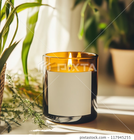 Amber glass candle jar mockup, cylindrical amber candle with blank label, candle burning, cozy sunny bright home interior decor 117945255