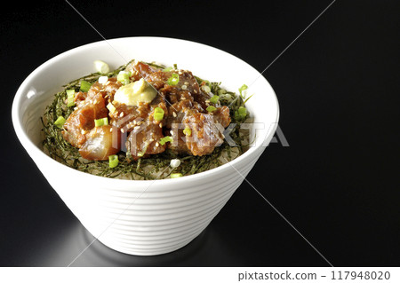 Black sea bream miso rice bowl photographed against a black background 117948020
