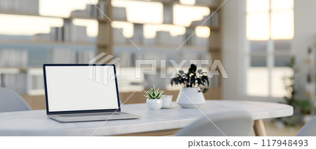 A laptop on a white marble meeting table in a contemporary minimalist meeting room. 117948493