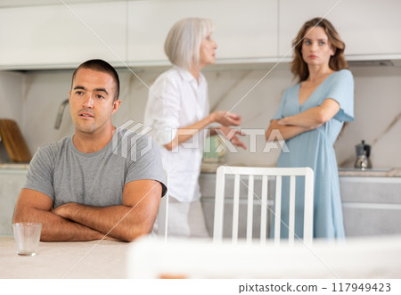 Young wife and mother quarrel son 117949423