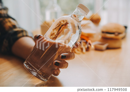 healthy beautiful young woman holding glass of water healthy beautiful young woman holding glass of water 117949508