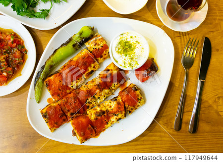 Beyti kebab served with refreshments 117949644