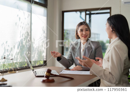 Asian female lawyers in consultation about legal matters Asian female lawyers in consultation about legal matters 117950361