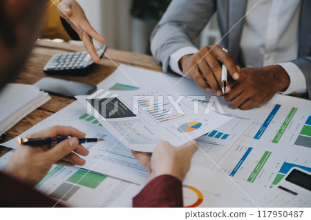 Group of Young Asian business team creative businesspeople coworker in office Happy to be successful partnership teamwork celebrating achievement and success concept. 117950487