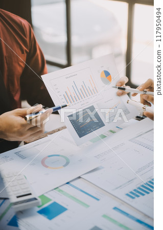 Group of Young Asian business team creative businesspeople coworker in office Happy to be successful partnership teamwork celebrating achievement and success concept. 117950494