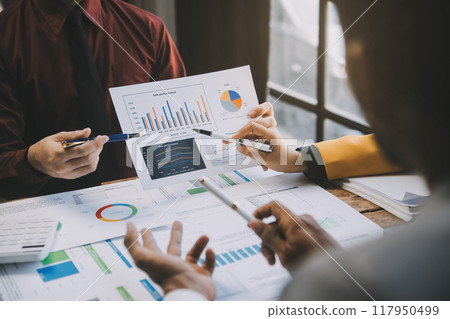Group of Young Asian business team creative businesspeople coworker in office Happy to be successful partnership teamwork celebrating achievement and success concept. 117950499