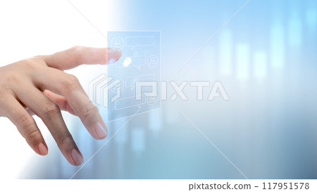 A hand is touching a screen with a blue background 117951578