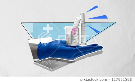A person is holding a beaker with a liquid in it A person is holding a beaker with a liquid in it 117951598