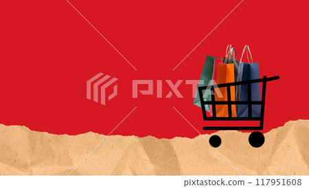 A shopping cart is filled with bags and is on a red background 117951608
