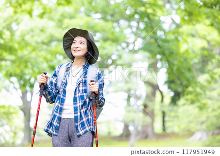 Middle-aged woman enjoying hiking 117951949