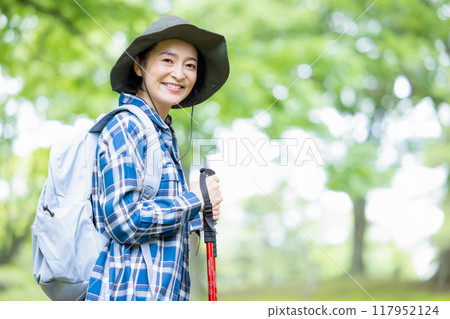 Middle-aged woman enjoying hiking 117952124