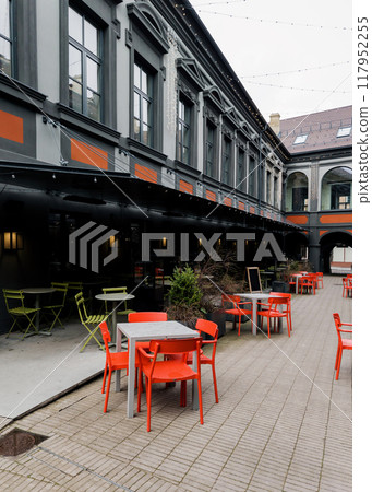 Cozy street with tables of cafe Cozy street with tables of cafe 117952255