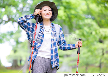 Middle-aged woman enjoying hiking 117952297