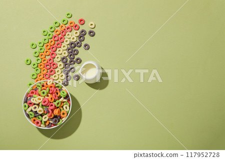 Colorful cornflakes, concept of tasty breakfast, morning food, space for text 117952728