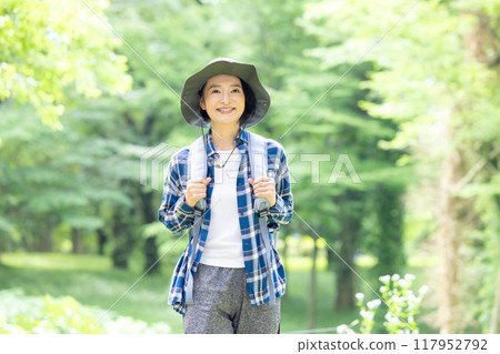 Middle-aged woman enjoying hiking 117952792